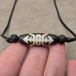 Dzi Stein Halskette „Glück“ kaufen – Tradition und Bedeutung