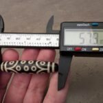 Echter dzi-stein 21-augen. bestimmen die Größe des Steins